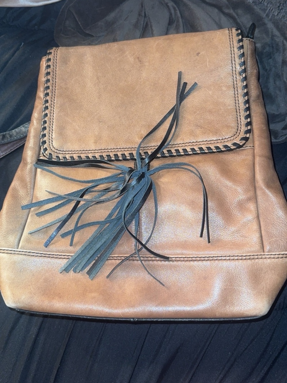brown leather book bag